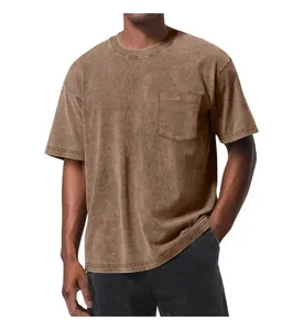 Close-up detail of a vintage washed brown oversized T-shirt featuring a chest pocket