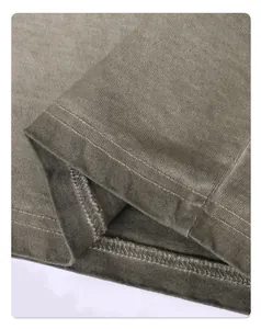 Close-up of double-needle stitching and washed cotton texture on T-shirt hem