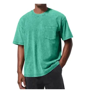 Close-up view of a green washed cotton T-shirt with pocket and drop shoulder