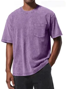 Detailed view of an oversized vintage purple wash T-shirt with a pocket on a male model.