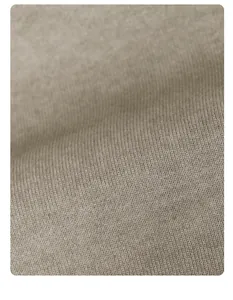 Macro view of vintage washed cotton fabric texture for oversized t-shirt in taupe color