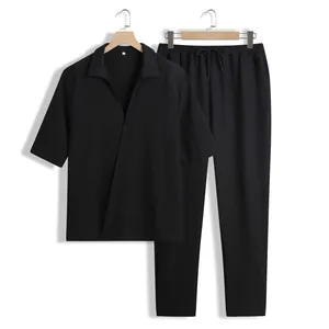 Ensemble deux pièces noir pour homme avec chemise à manches courtes et pantalon à cordon