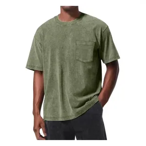 Vintage washed green oversized t-shirt with front pocket and drop shoulder design