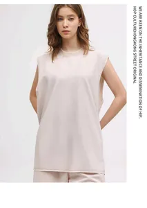 Detailed shot of oversized washed cotton tank top with raw edges and vintage texture