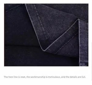 Close-up showing the neat hem stitching on a vintage washed distressed oversized vest