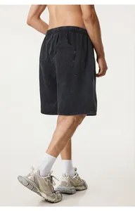Men's vintage washed black distressed cotton shorts in a loose streetwear street style fit