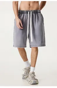 Detail view of men's vintage washed grey shorts with elastic waist and white drawstrings