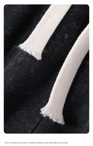 Close-up detail showing the white cotton drawstring on these vintage black washed cotton shorts