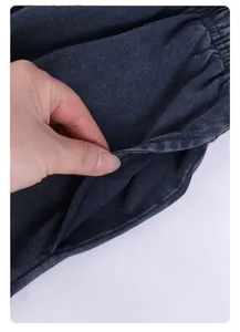 Detailed macro view showing the side pocket of vintage washed dark navy cotton shorts