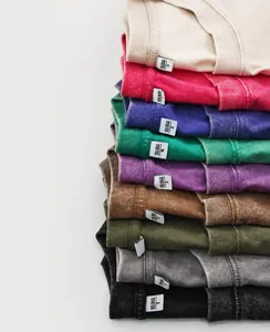 Close-up detail of multi-color heavyweight washed vintage cotton T-shirts with worn texture