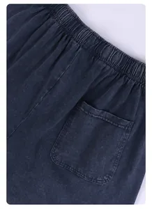 Detail of vintage washed charcoal cotton shorts showing elastic waist and back pocket