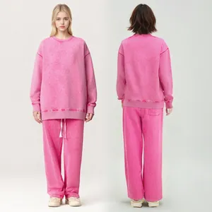 Front and back view of a pink vintage acid-wash sweatshirt and sweatpants set detail