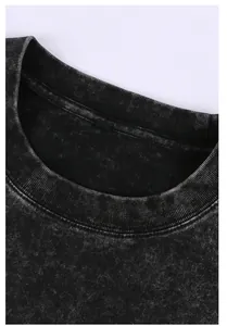 Close-up of a vintage acid-washed cotton t-shirt collar with ribbed texture detail.