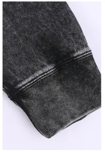 Macro view of vintage washed charcoal grey ribbed cuff on a cotton long sleeve shirt