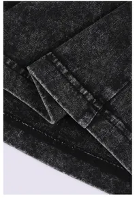 Detailed close-up showing double-stitched hem and texture of vintage black washed cotton T-shirt