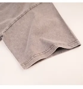 Detailed view of vintage snowflake washed t-shirt sleeve with double stitching.