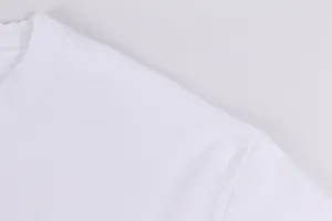 Close-up of distressed neckline and shoulder stitching on a heavy white cotton T-shirt