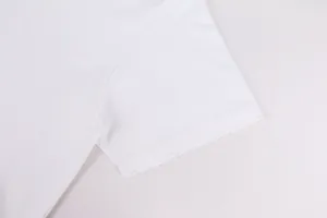 Close-up detail of white 420g heavyweight cotton T-shirt with distressed sleeve edge