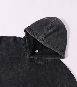 Close-up detail of vintage washed oversized hoodie showing the hood design and texture