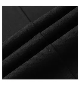 Détail macro d'un tissu en coton noir de haute qualité avec texture tricotée fine