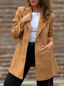 Detail of a chic camel woolen coat with lapels and buttons for autumn winter style