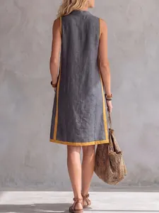 Back view of a grey cotton linen sleeveless dress with contrast yellow trim