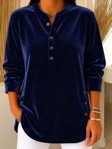 Detail view of a luxury navy blue velvet long sleeve shirt featuring decorative side buttons