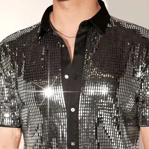 Close-up detail of silver sequin men's shirt with black collar and shiny finish
