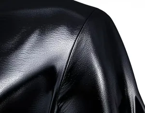 Detailed view of the glossy black metallic fabric on a men's stage performance tee