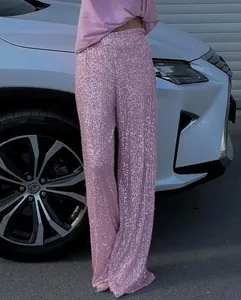 Close-up of pink sequined straight-leg trousers for a glamorous and stylish evening look