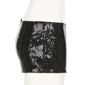 Close-up of black shimmering sequins on low-waist sexy hot pants for women.