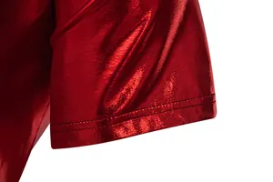 Close-up detail of red metallic shiny fabric on short sleeve cuff