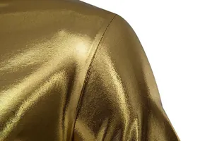 Close-up of golden metallic fabric and stitching on men's shiny stage T-shirt