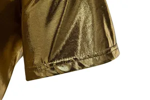 Close-up detail of metallic gold fabric and hem on a men's shiny stage T-shirt