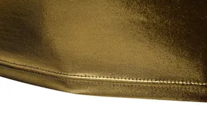Close-up of shiny gold metallic fabric and double-stitched hem on men's party T-shirt.