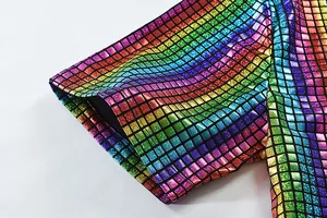 Detail of rainbow holographic mosaic sequin shirt fabric for festival or cosplay