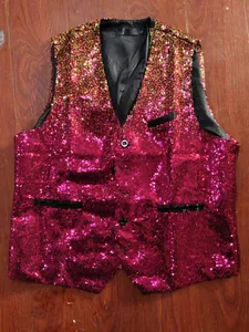 Detail view of men's stage vest with gold to pink gradient sequins and black trim