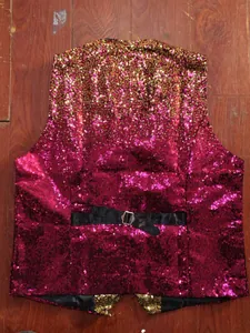 Detailed back view of a gradient sequin vest with an adjustable black strap.