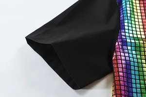 Close-up detail of black shirt sleeve with colorful rainbow metallic sequin pattern texture