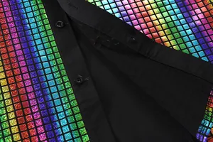 Detailed macro view of colorful rainbow sequins and black buttons on a men's shirt