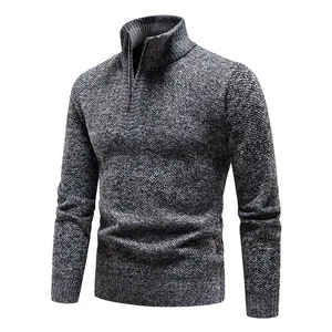 Detailed view of grey marl knit sweater featuring a stand collar and quarter-zip closure