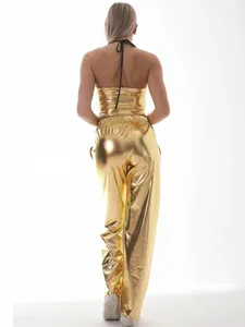 Detailed back view of shiny gold metallic halter top and loose pants for hip-hop party.