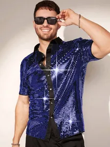 Detailed view of men's sparkling blue sequin short sleeve shirt with contrast black collar.