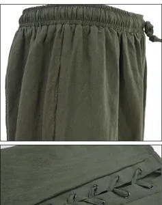 Vista detallada de pantalones medievales verde oscuro con cintura elástica y diseño cordón