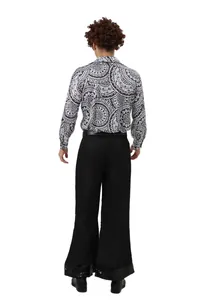 Back view of a 70s retro disco costume with black and white patterned shirt and flared pants.