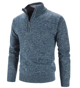 Close-up detail of blue textured men's half-zip knit sweater with ribbed stand collar