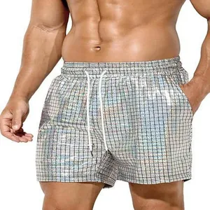 Detail view of men's silver holographic grid beach shorts with drawstring waist