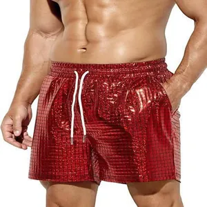 Detailed close-up showing shiny red metallic grid texture of men's casual beach shorts