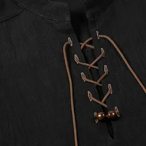Close-up detail of a vintage Henley shirt showing the black linen fabric and lace-up neck.