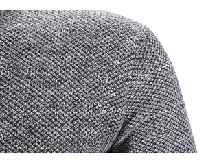 Detail showing the thick textured grey knit fabric on a men's winter sweater shoulder